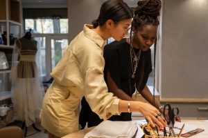 Fashion designers working in a clothing design studio